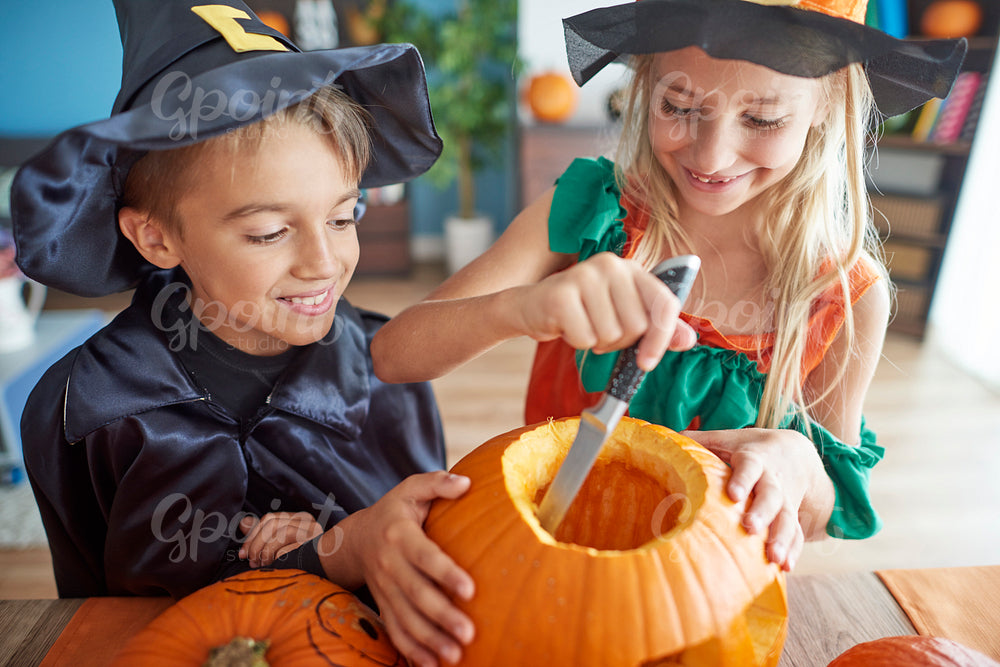 Girl and boy with Halloween pumpkin