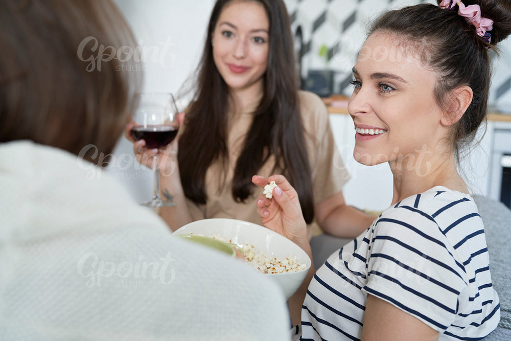 Friends spending nice time chatting at home