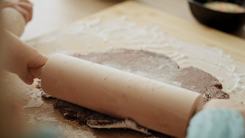 Video of girl making gingerbread pastry with rolling pin