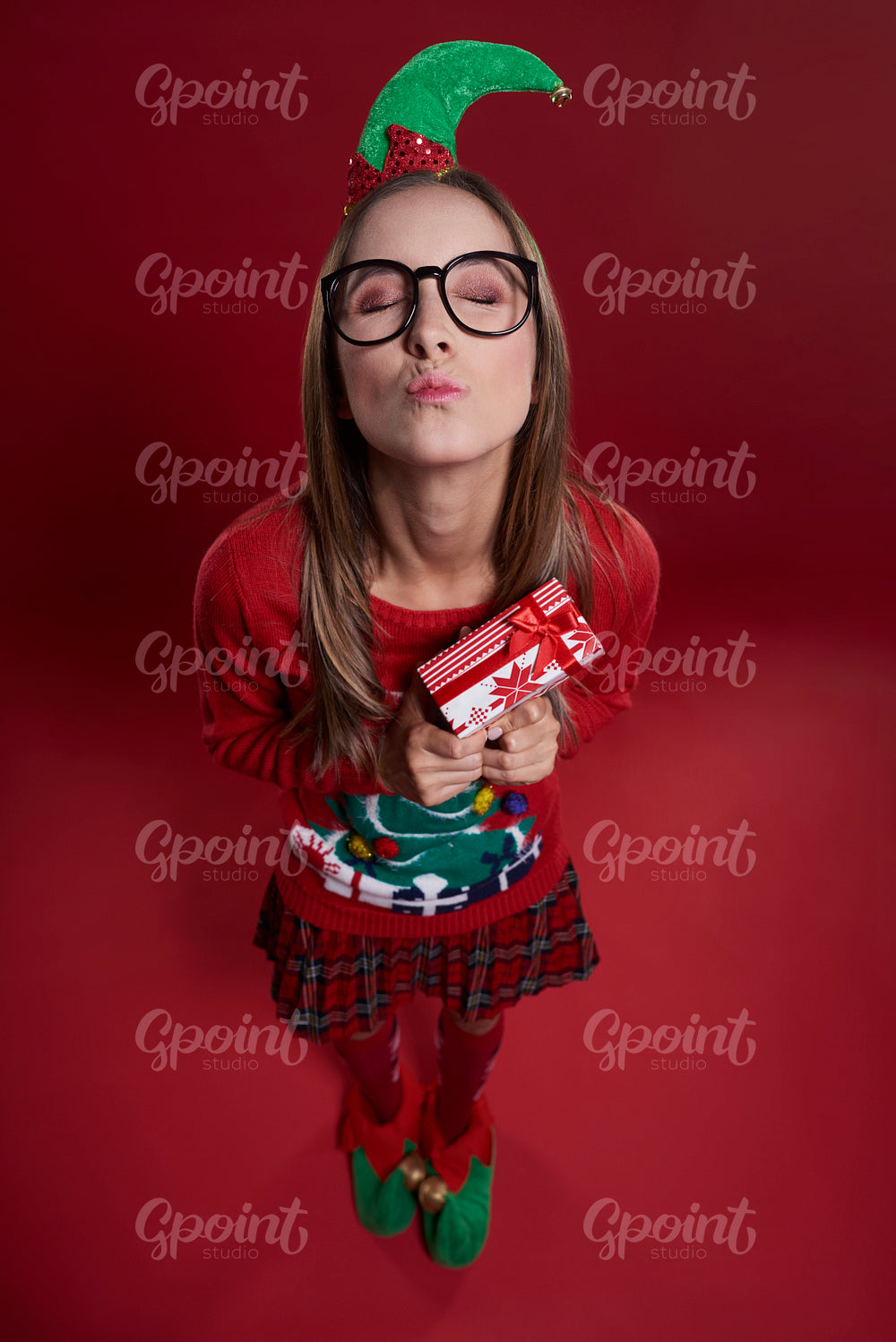 Cute female nerd with small gift