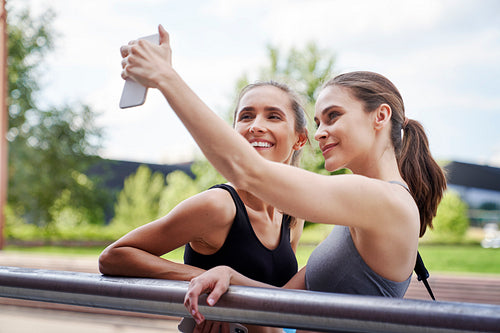 Two athletic women taking a selfie