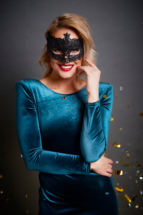 Portrait of beautiful woman with masquerade mask