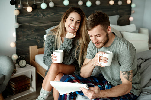 Couple with morning coffee and newspaper