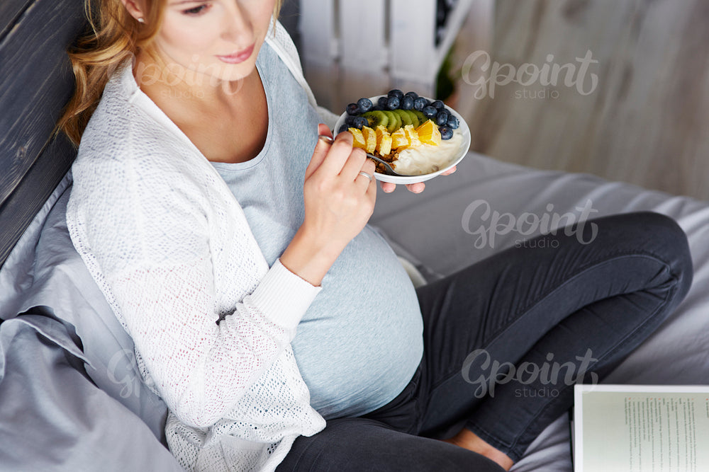 Pregnant woman relaxing at home
