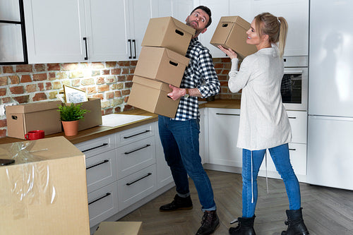 Couple take the cardboard boxes when they move out