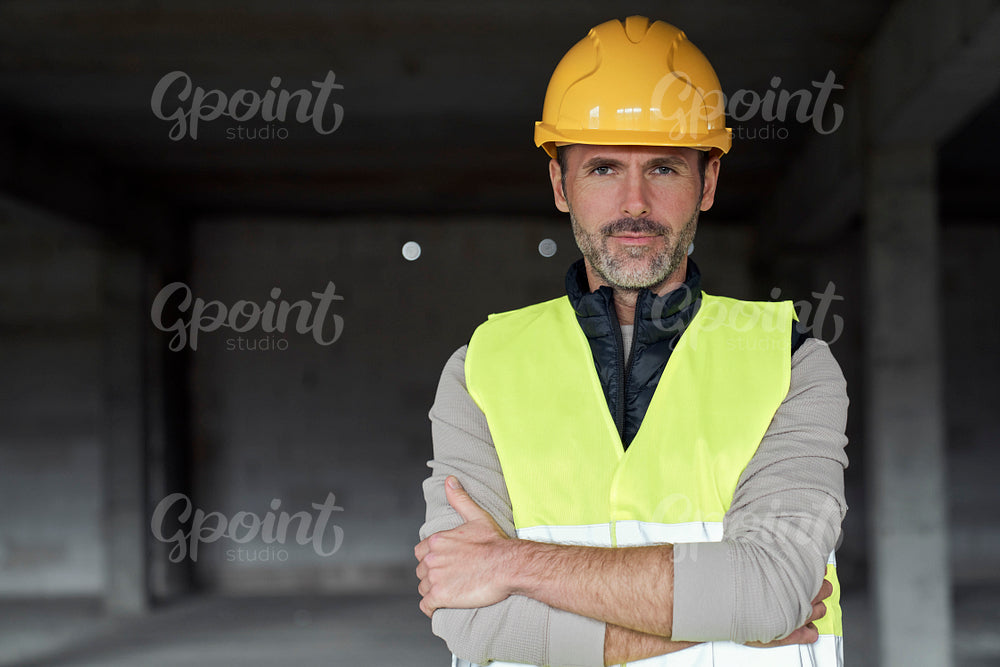 Portrait of mature caucasian man on the construction site 