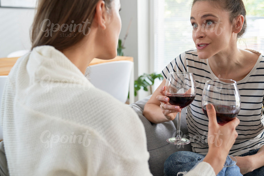 Vivid discussion of friends with a glass of wine