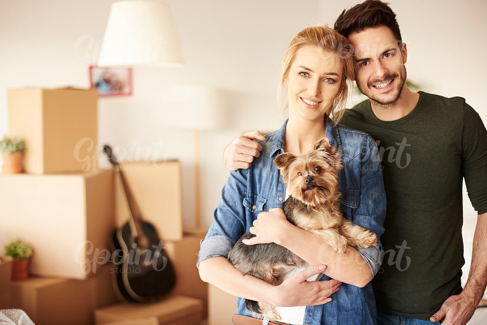 Portrait of couple with small pet