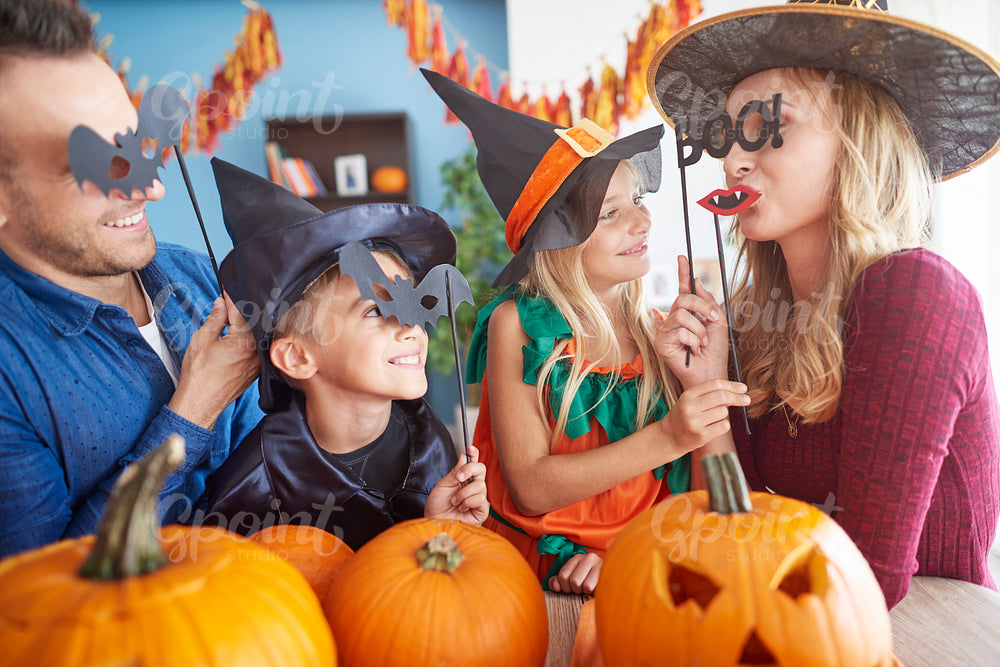 Playful family in halloween masks