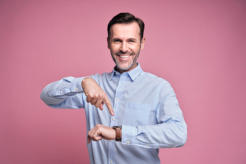 Happy man showing for smart watch