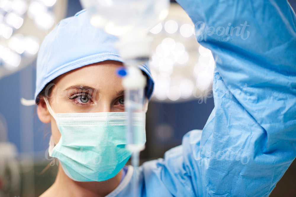 Female anesthesiologist during hard operation