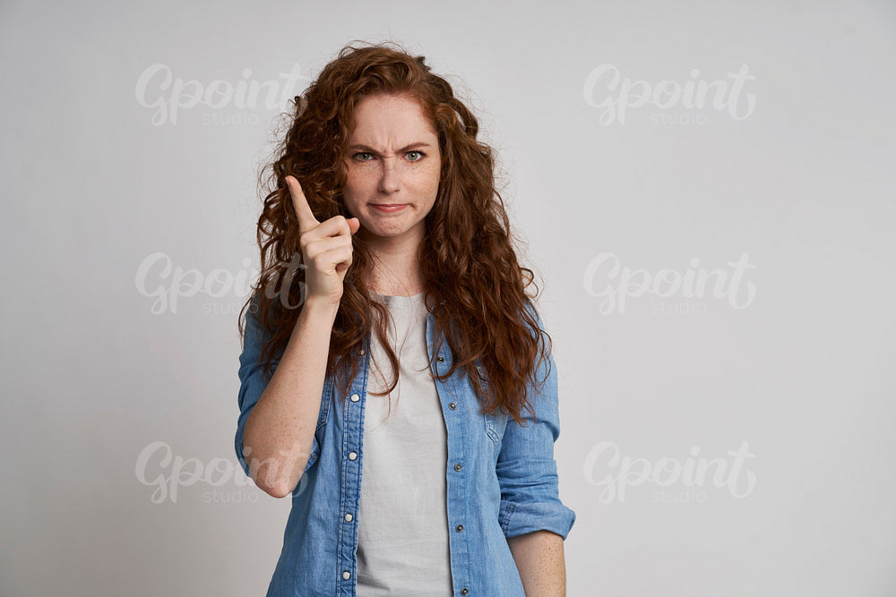 Dissatisfied woman with finger up