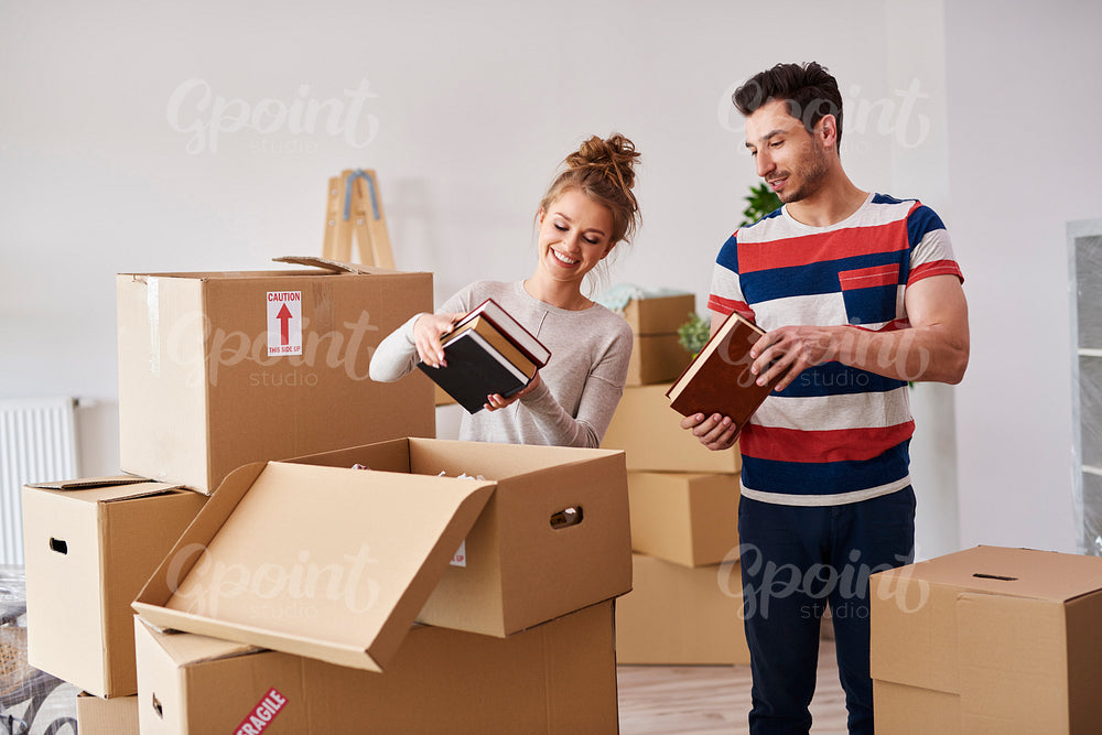 Young couple moving in to house