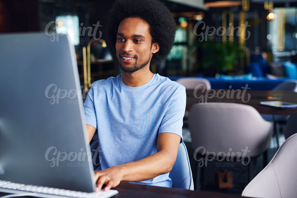 African man working on computer in the office