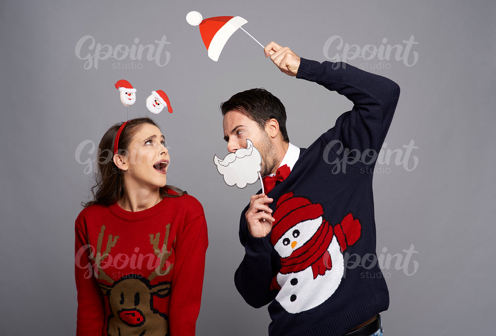 Playful couple celebrating Christmas time