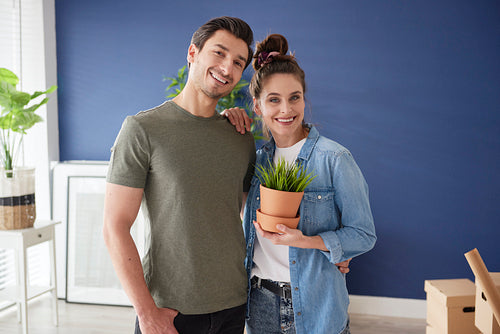 Portrait of young couple in new house