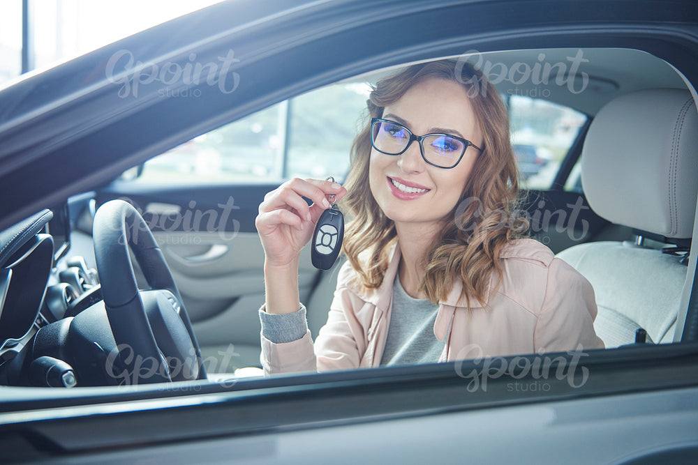 Attractive business woman with car keys