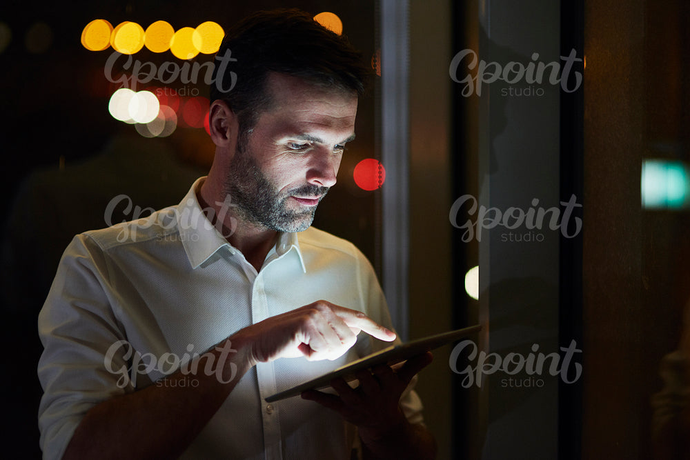 Businessman using a tablet in his office