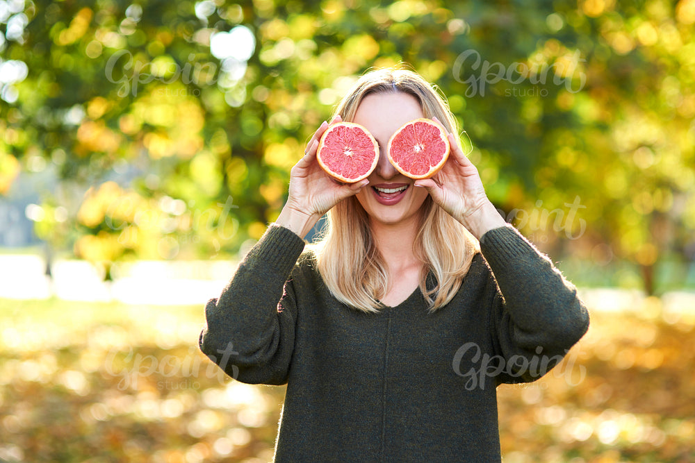 Both eyes covered with citrus fruit