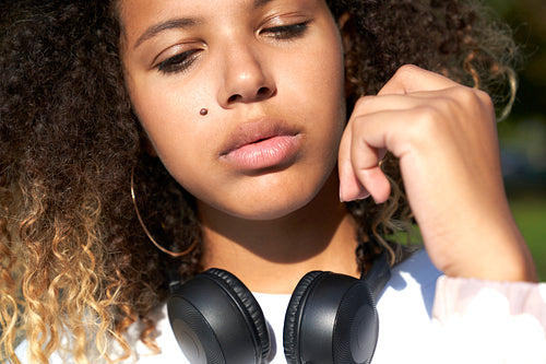 Close up of African woman with headphones