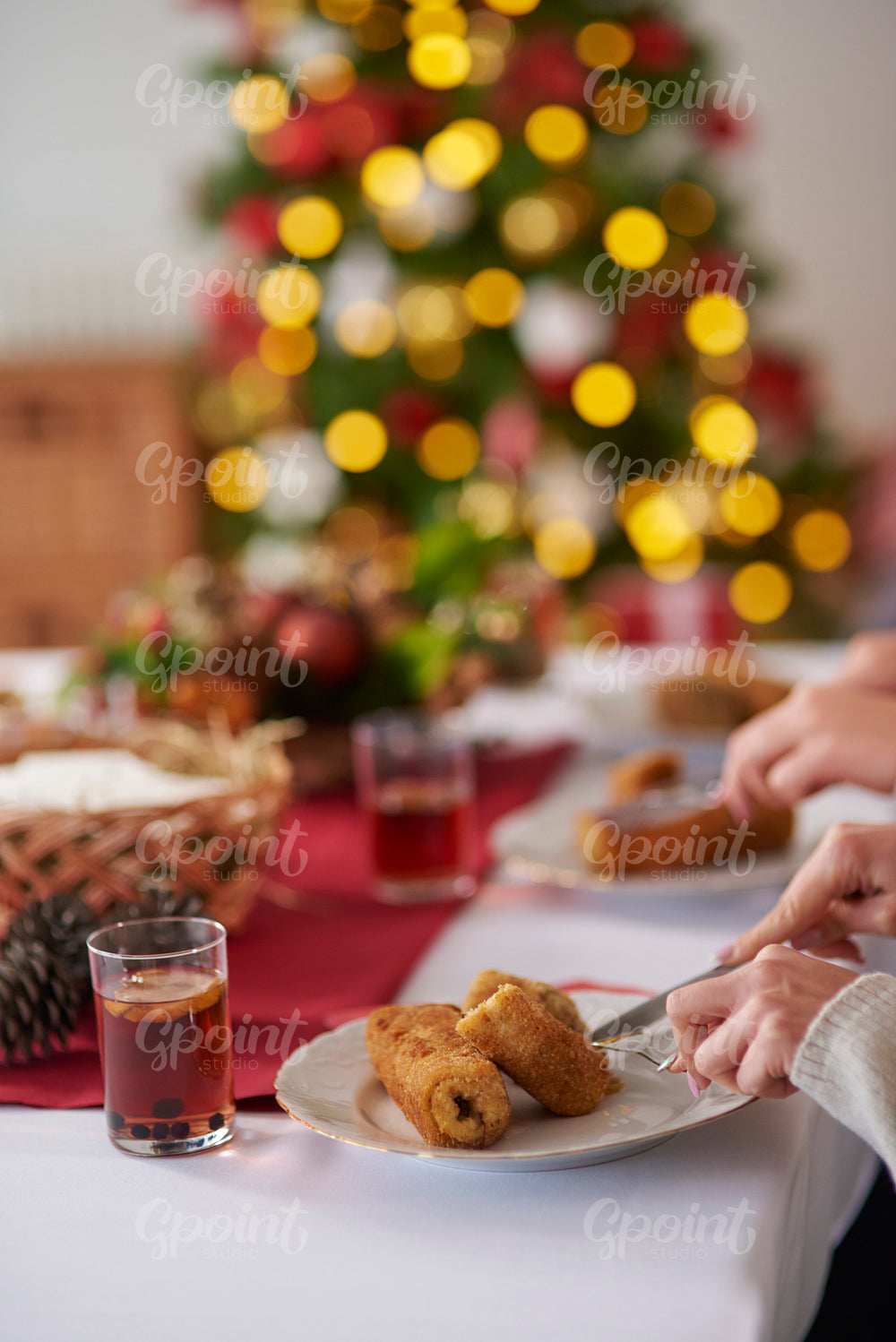People eating croquettes during the Christmas Eve