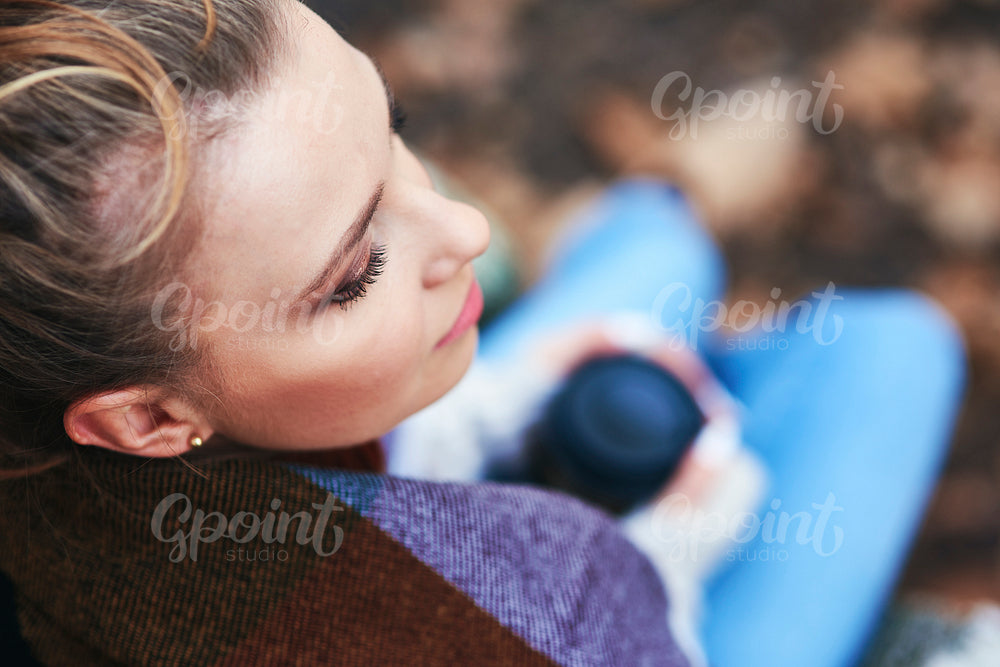 High angle view of beautiful woman relaxing in autumn
