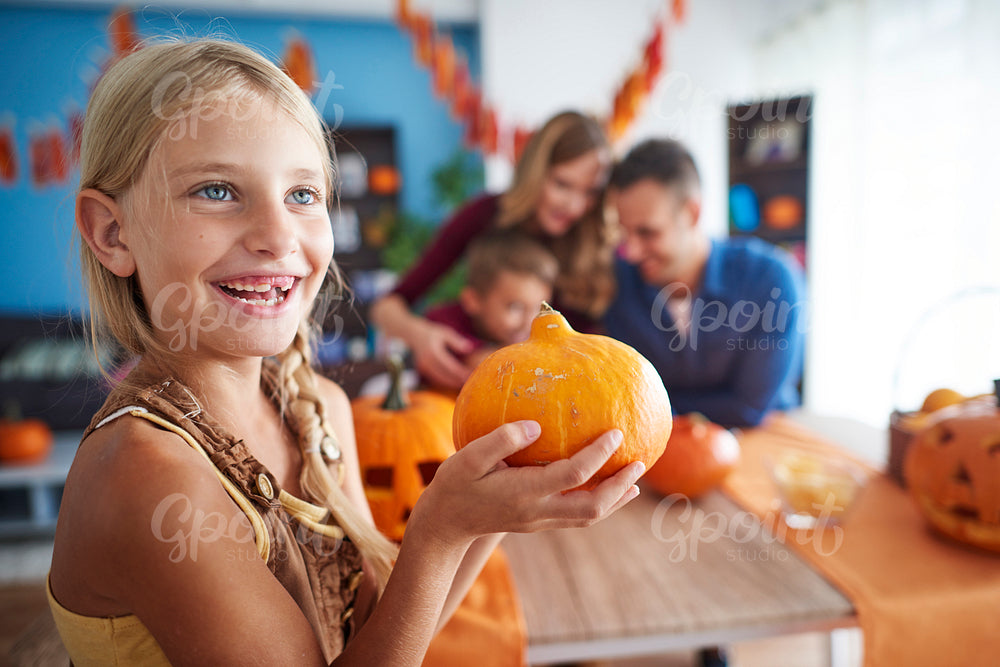 Cute girl with Halloween pumpkin