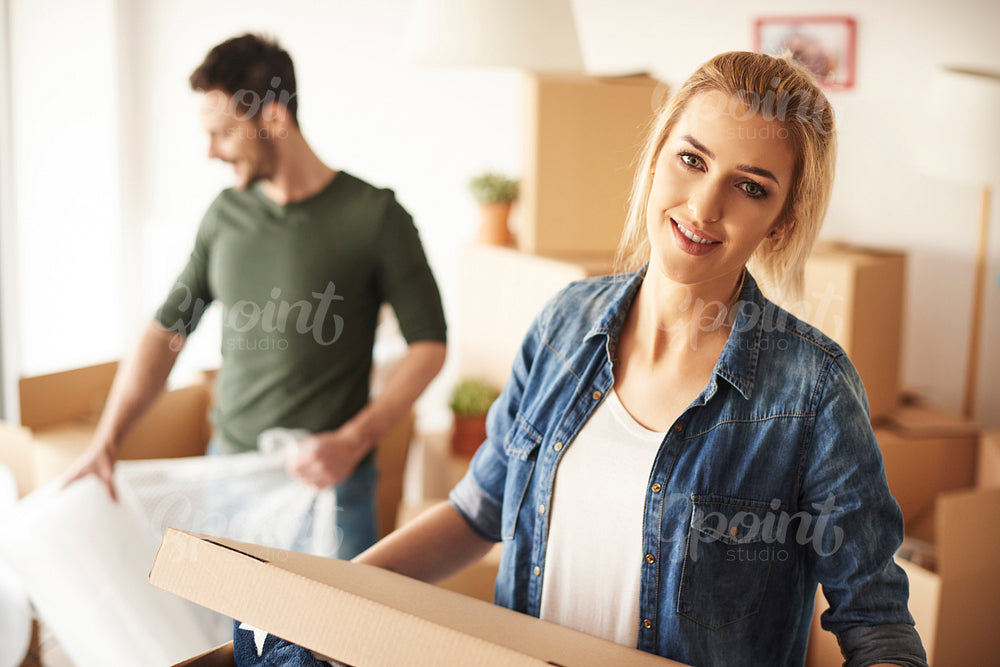 Couple unpacking their stuff to new home