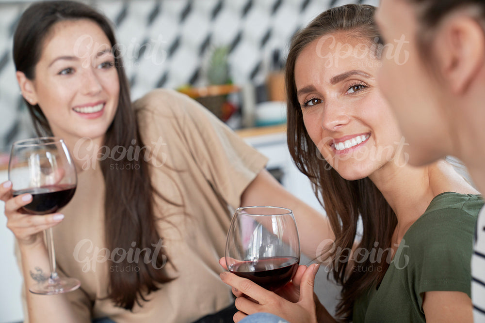 Friends spending time together drinking wine