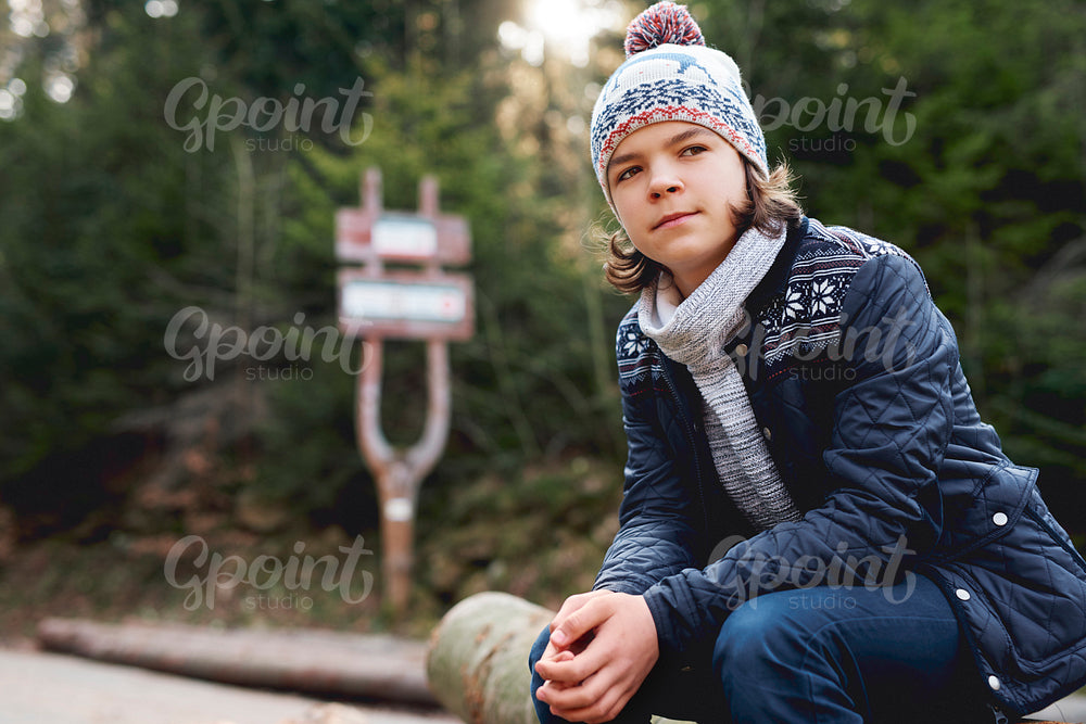 Teenage boy in the autumn forest