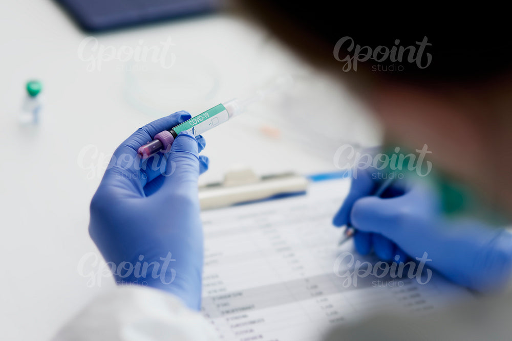 Doctor making notes after coronavirus test