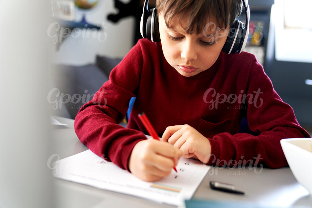 Close up of boy doing homework during a lockdown