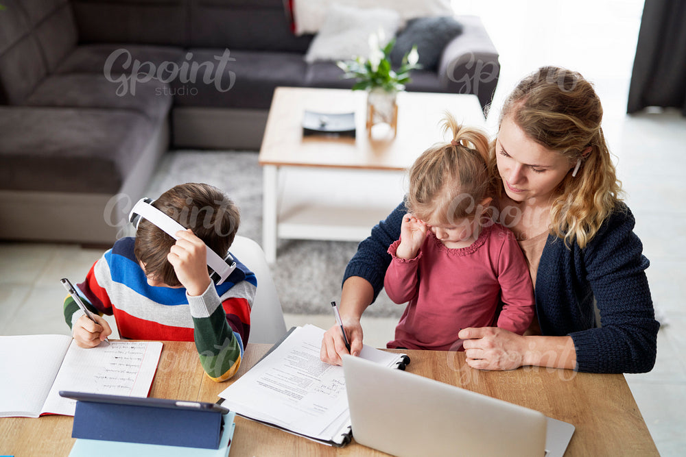 Top view of mother during home office with children