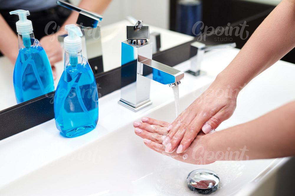 Washing hands in the bathroom