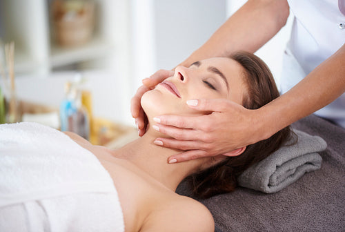 Massage of face at the spa salon