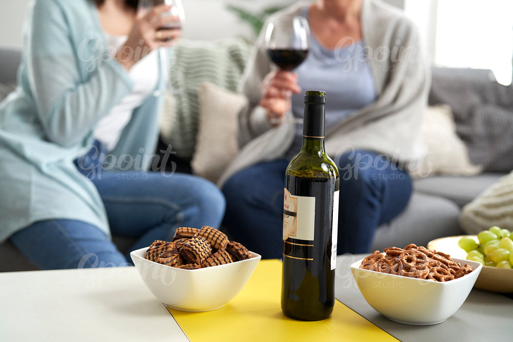 Bottle of wine and snack on the table