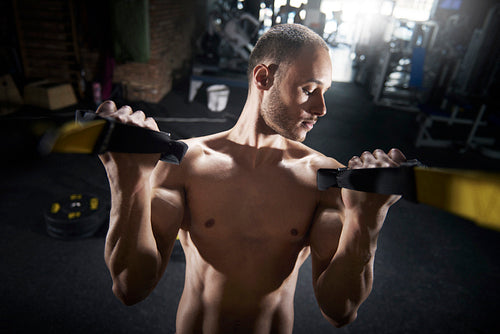 Young man focus on biceps parts
