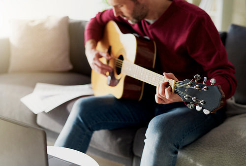 Man having first lesson with acoustic guitar