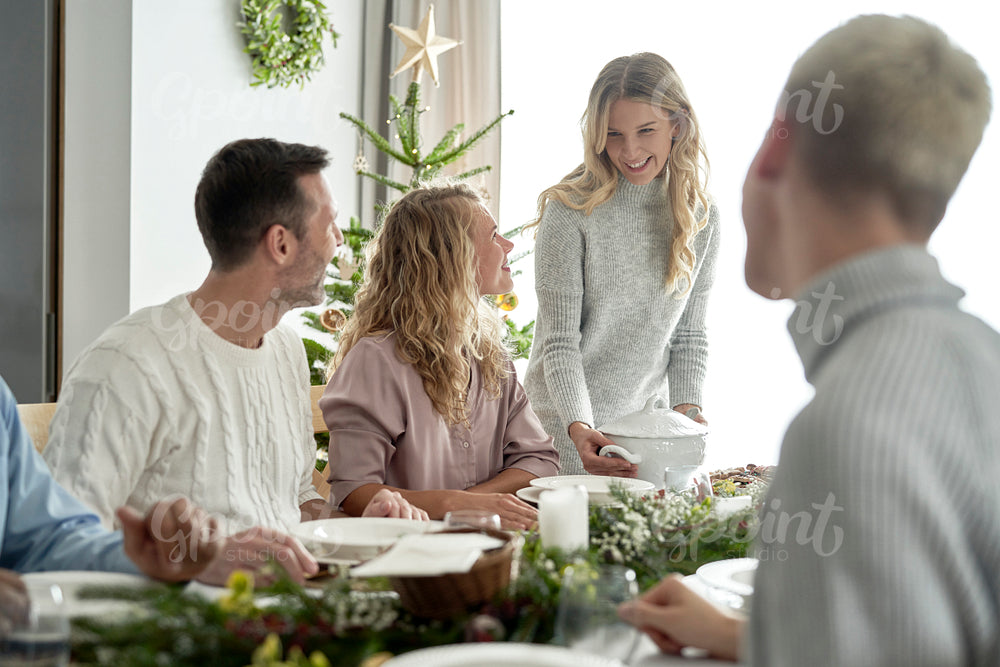Caucasian family serving traditional Polish soup on Christmas Eve          