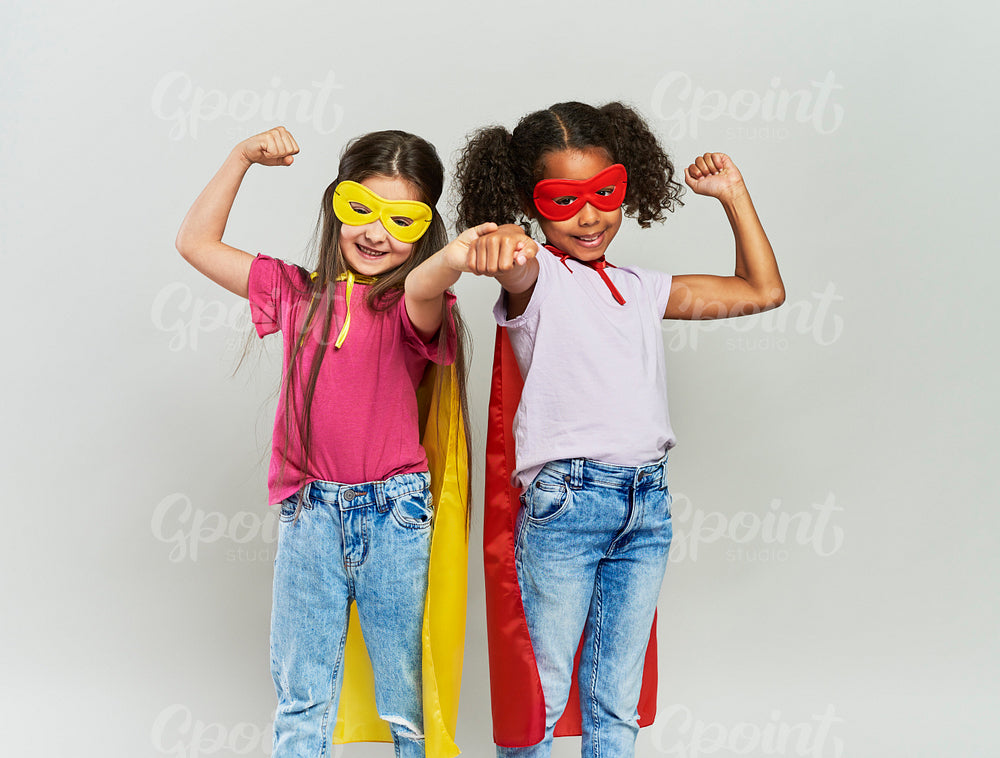 Two girls in superhero costume