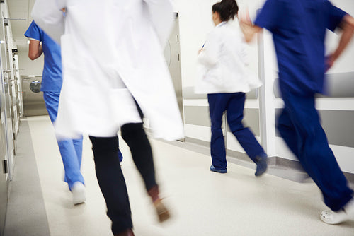 Blurred view of doctors running in a hurry