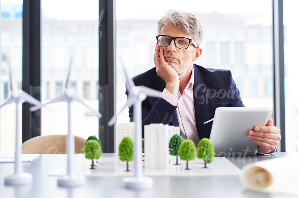 Tired businessman thinking about new solutions