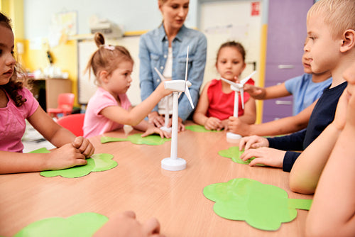 Model of wind turbine and children in the background