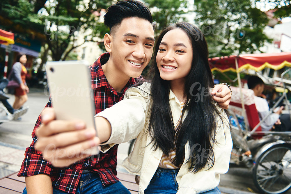 Close up selfie of young Vietnamese couple