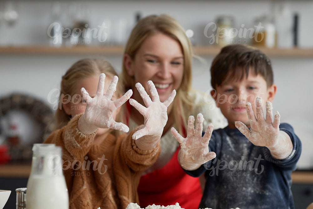 Happy children after baking with mother
