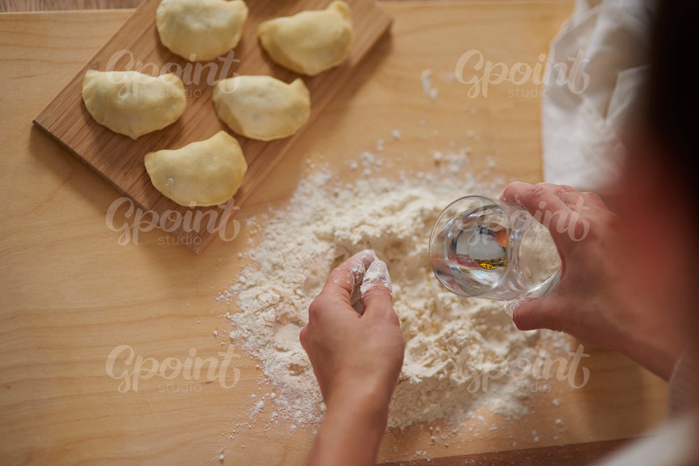 Woman making traditional homemade dumplings