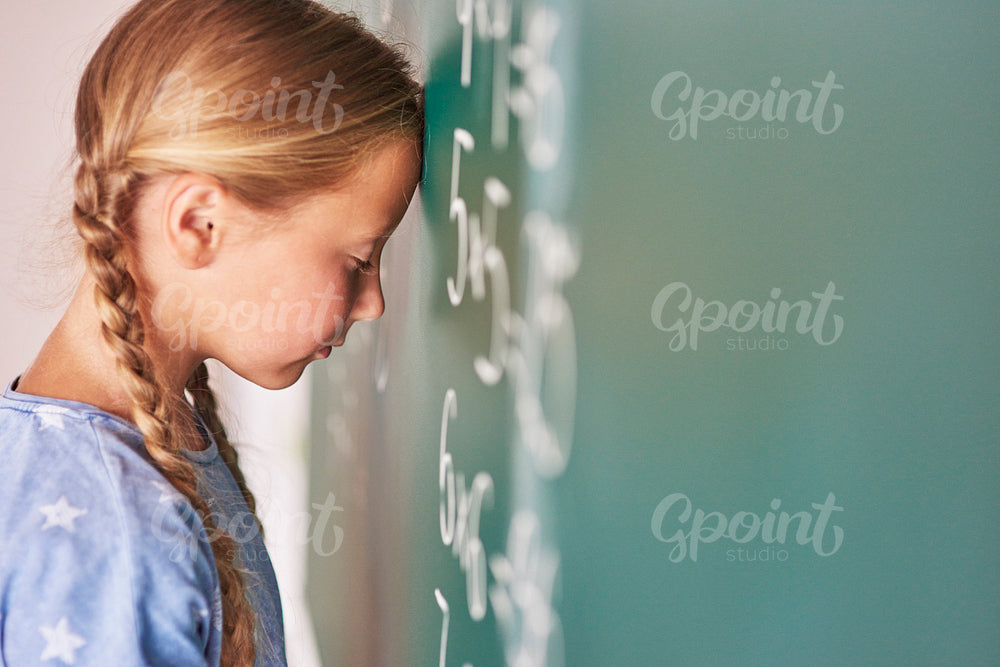 Schoolgirl trying to understand formula