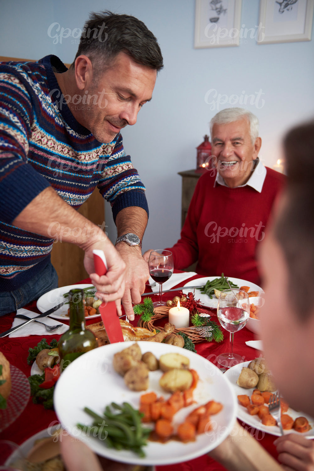 Affectionate man cutting the turkey meat