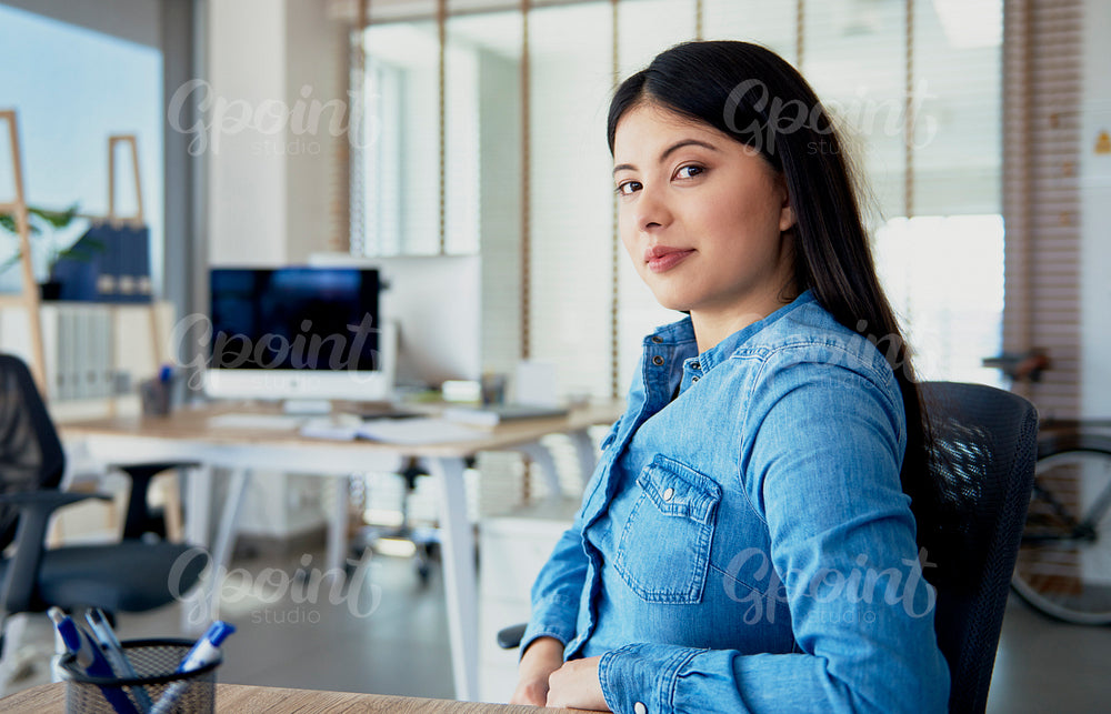 Bossy woman behind her desk