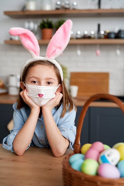 Portrait of girl in a protective mask and rabbit ears